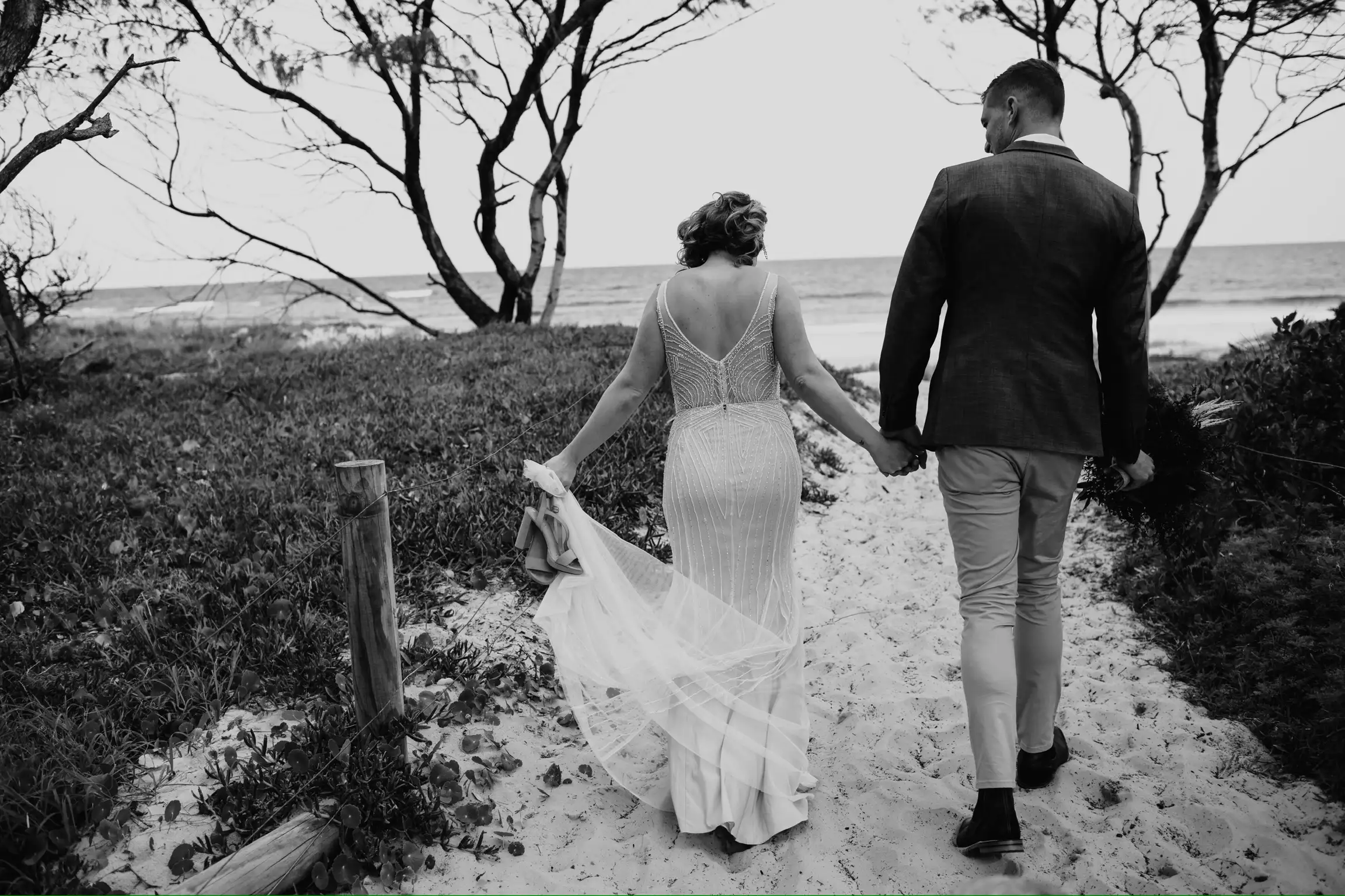 Lisa Fowler Wedding Hair and Makeup, Bride and Groom Walking on Lake Macquarie Beach