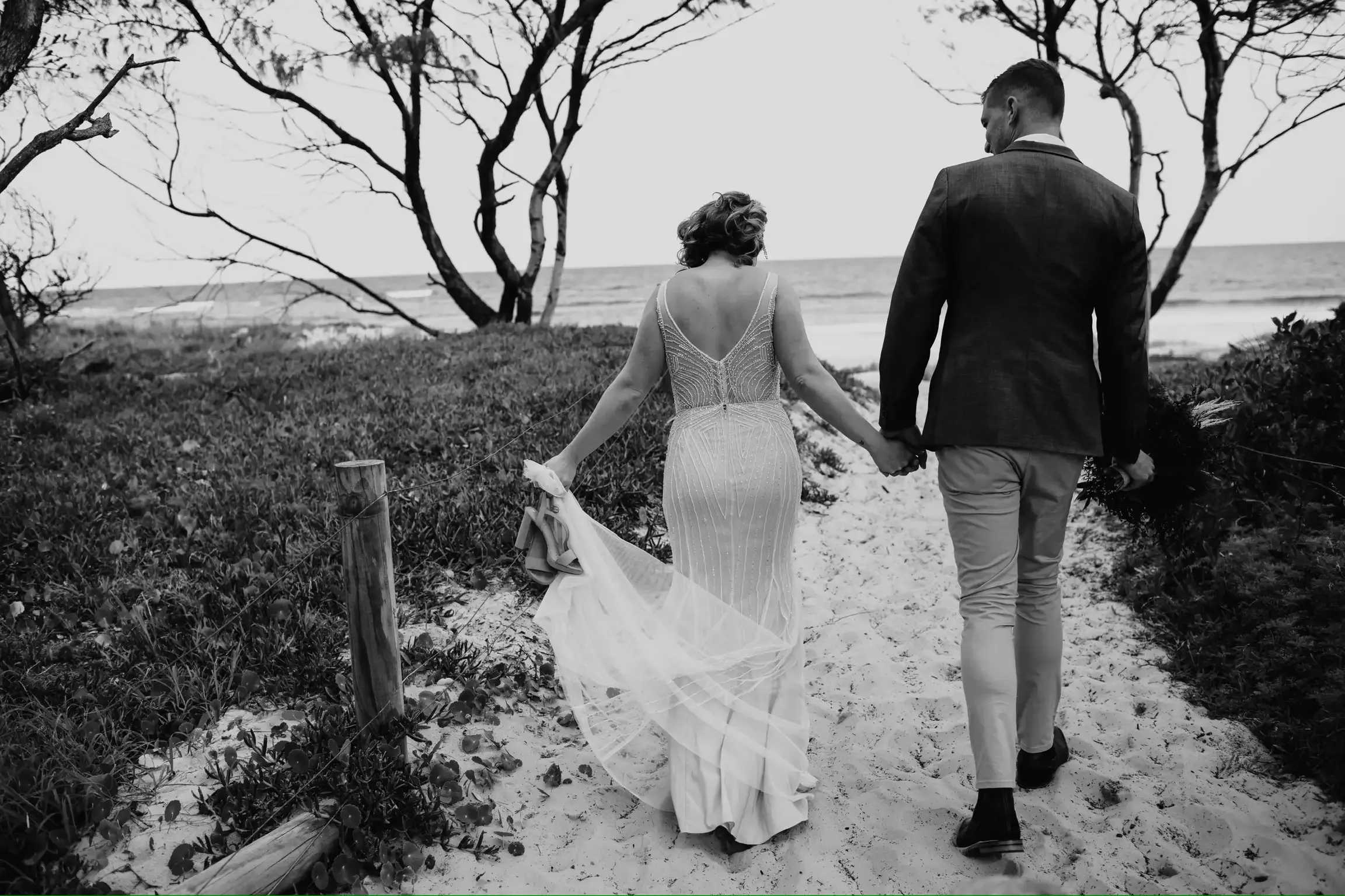 Lisa Fowler Wedding Hair and Makeup, Bride and Groom Walking on Lake Macquarie Beach
