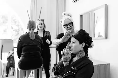 Lisa Fowler applying makeup at Estillo studio