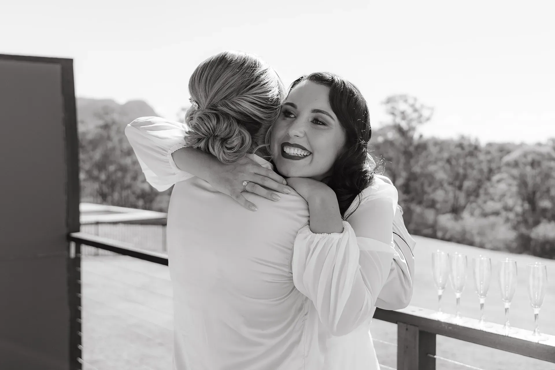 Bride embracing her mother on the morning of the wedding