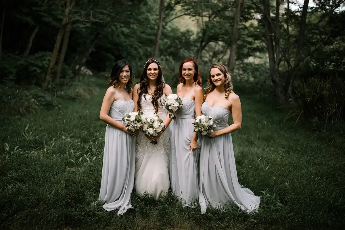 Bride and bridesmaids with soft bridal hair and makeup